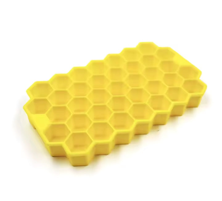 Stampo per ghiaccio giallo con celle esagonali senza coperchio