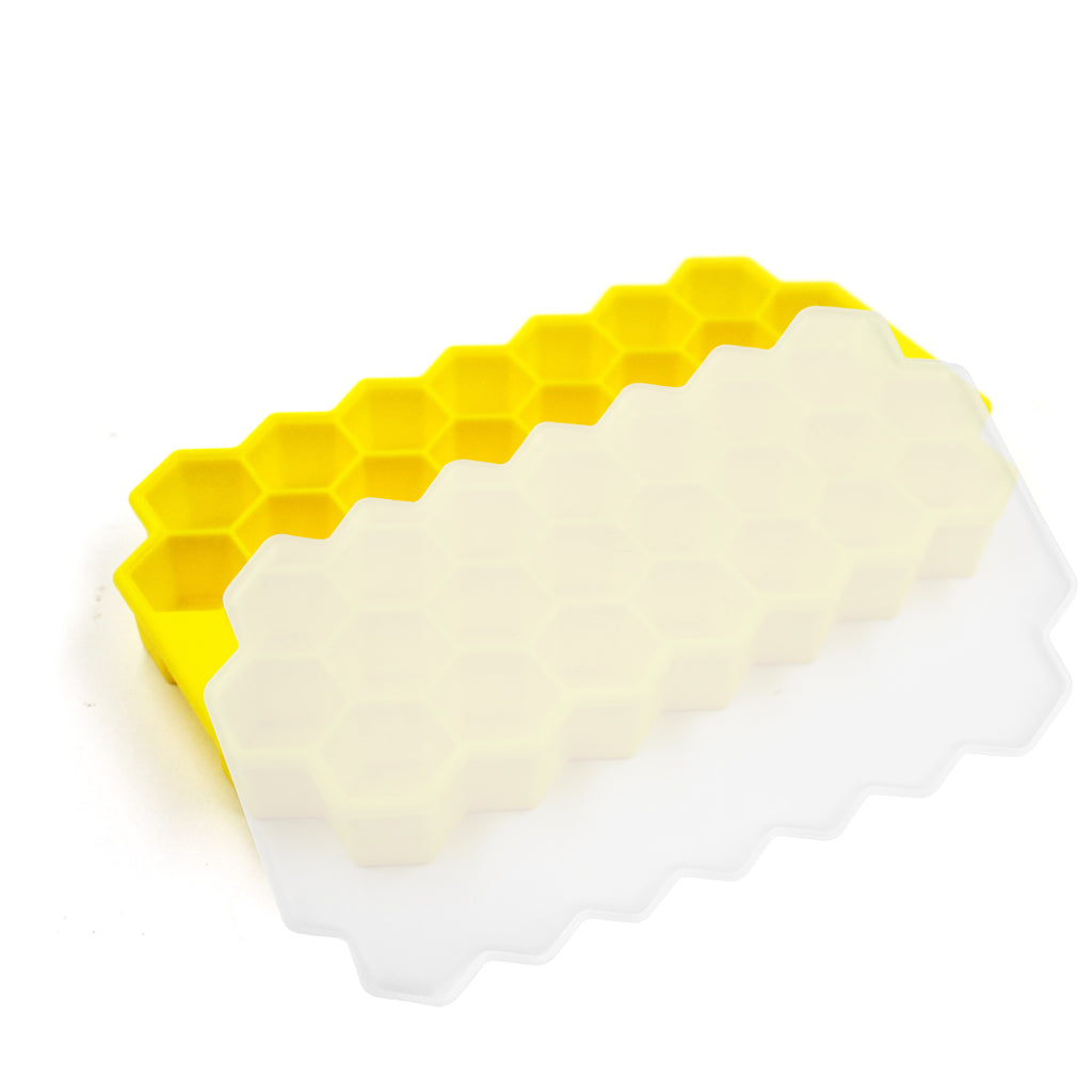 Stampo per ghiaccio in silicone giallo con celle esagonali e coperchio